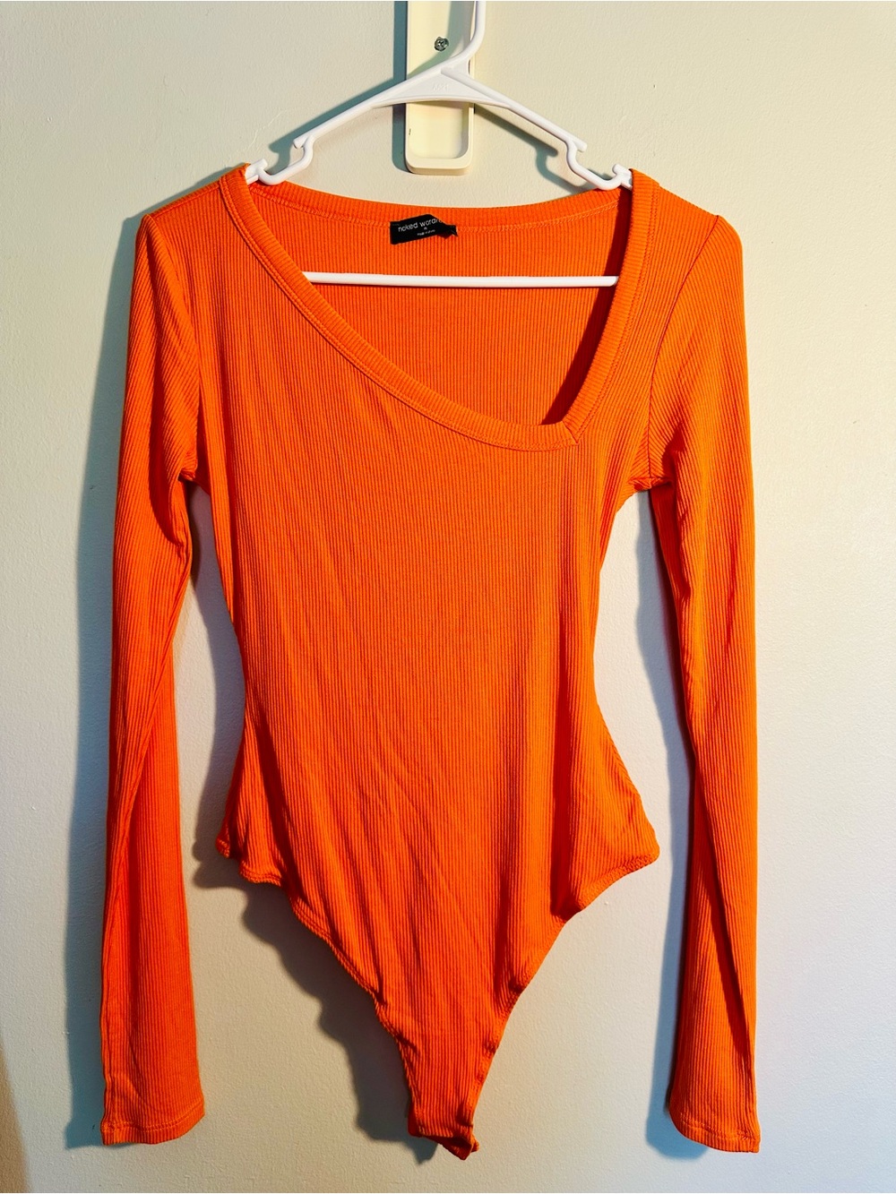 Naked Wardrobe Women’s Asymmetrical Neckline Orange Thong Bodysuit NWOT Medium